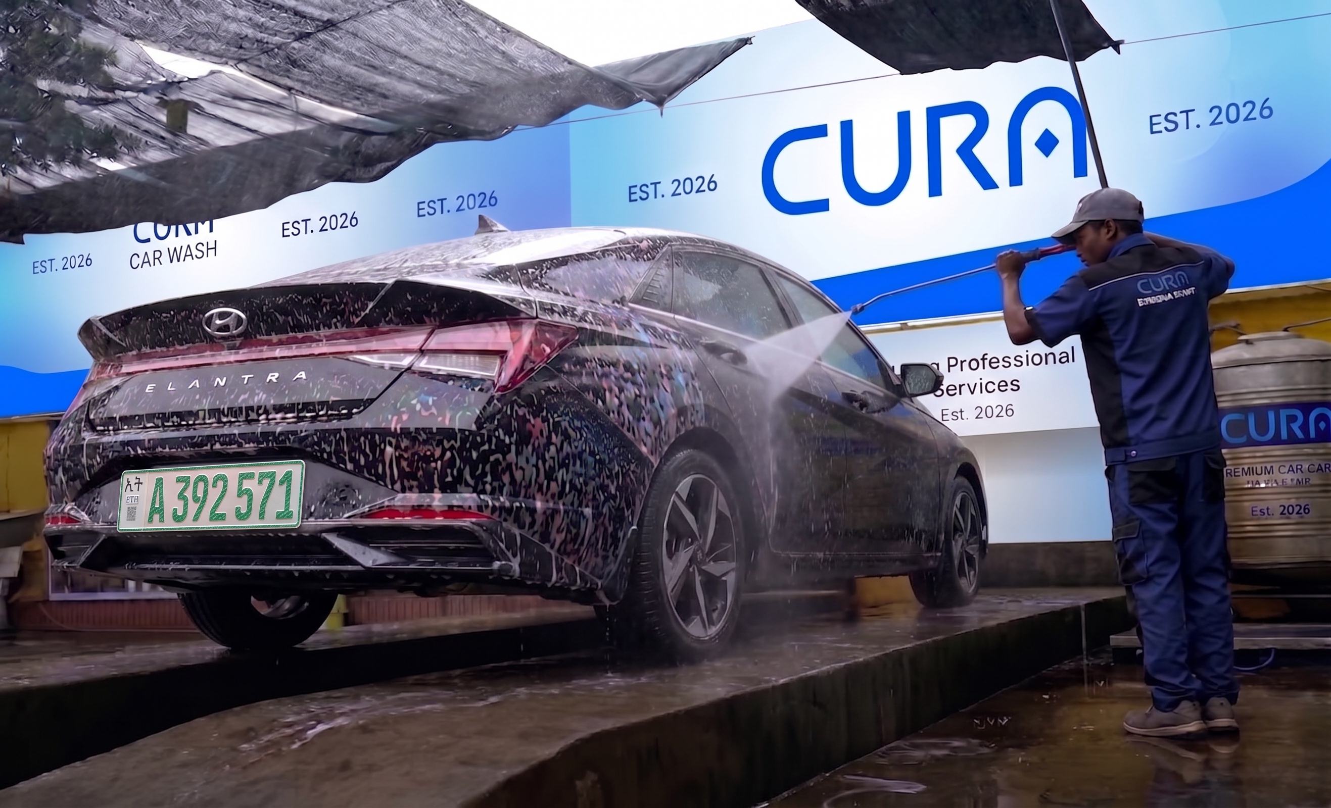 Car being hand washed at CURA Car Wash in Bole Bulbula, Addis Ababa